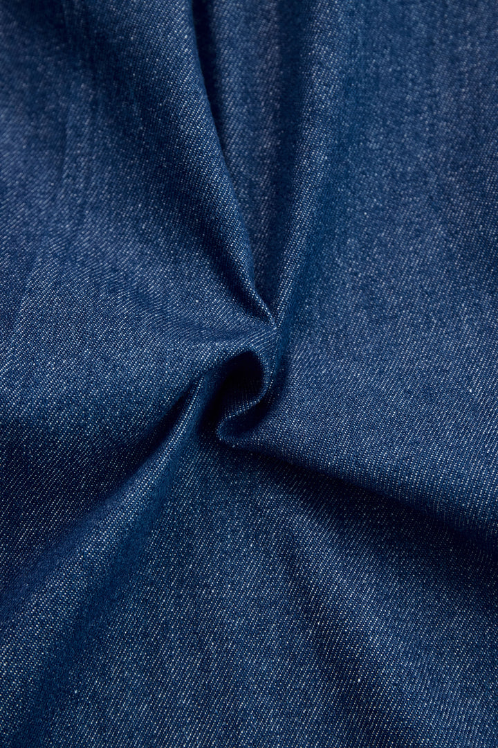 Dark blue denim fabric texture close-up