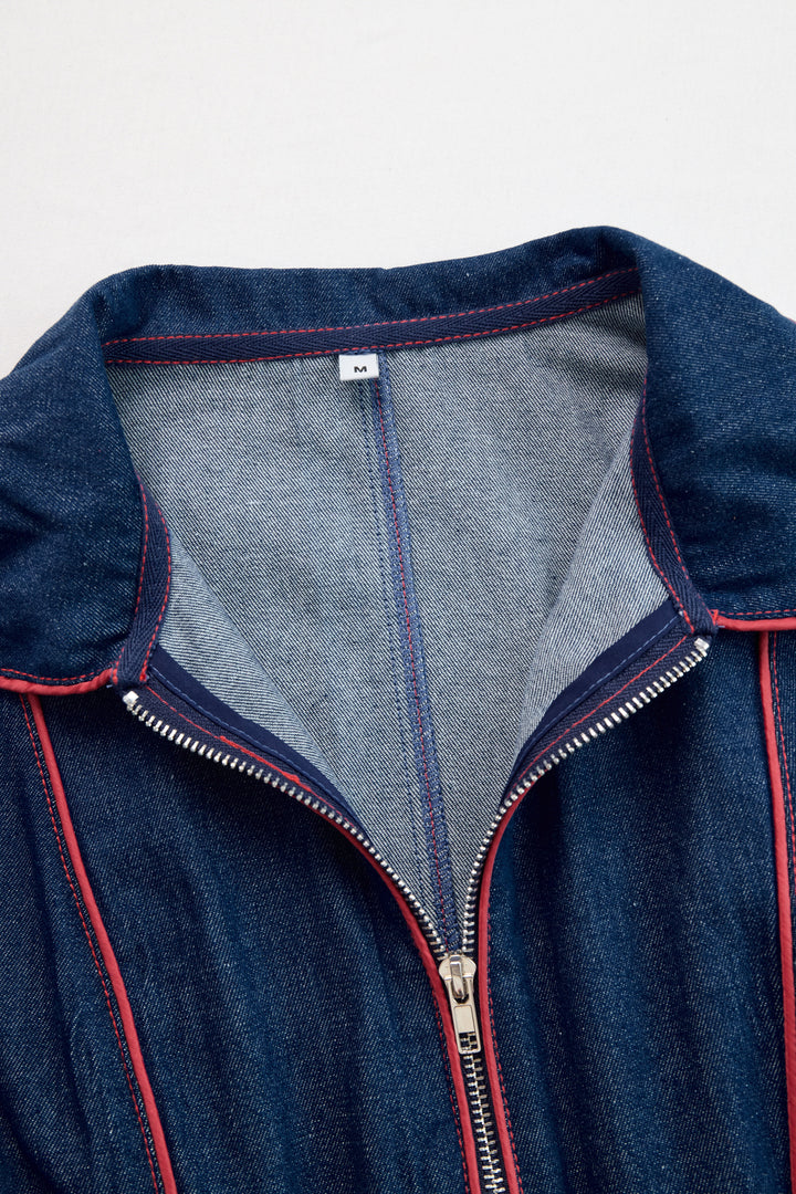 Close-up of stand collar and double zip with red topstitching