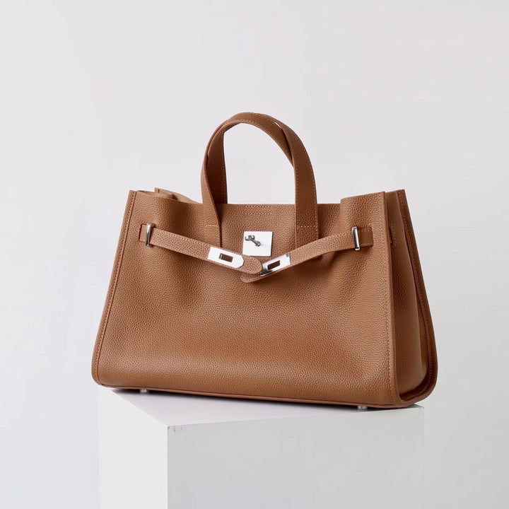 Brown leather work tote, front-on studio view