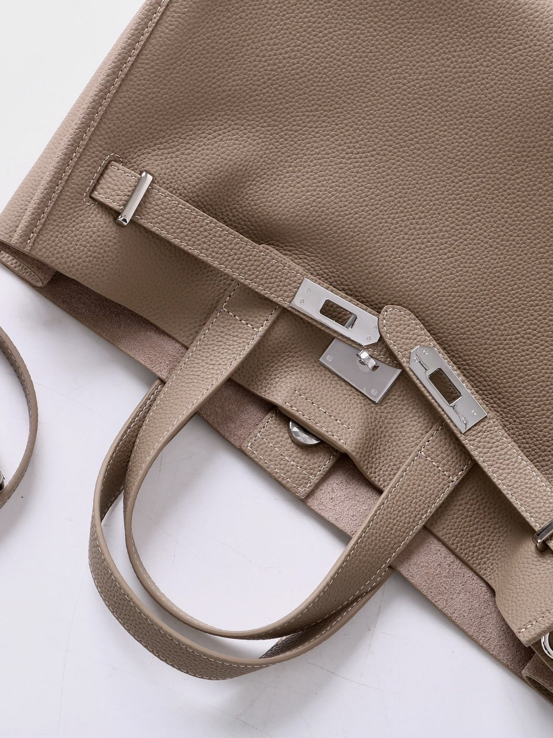 Grey leather tote, top-down hardware and strap detail