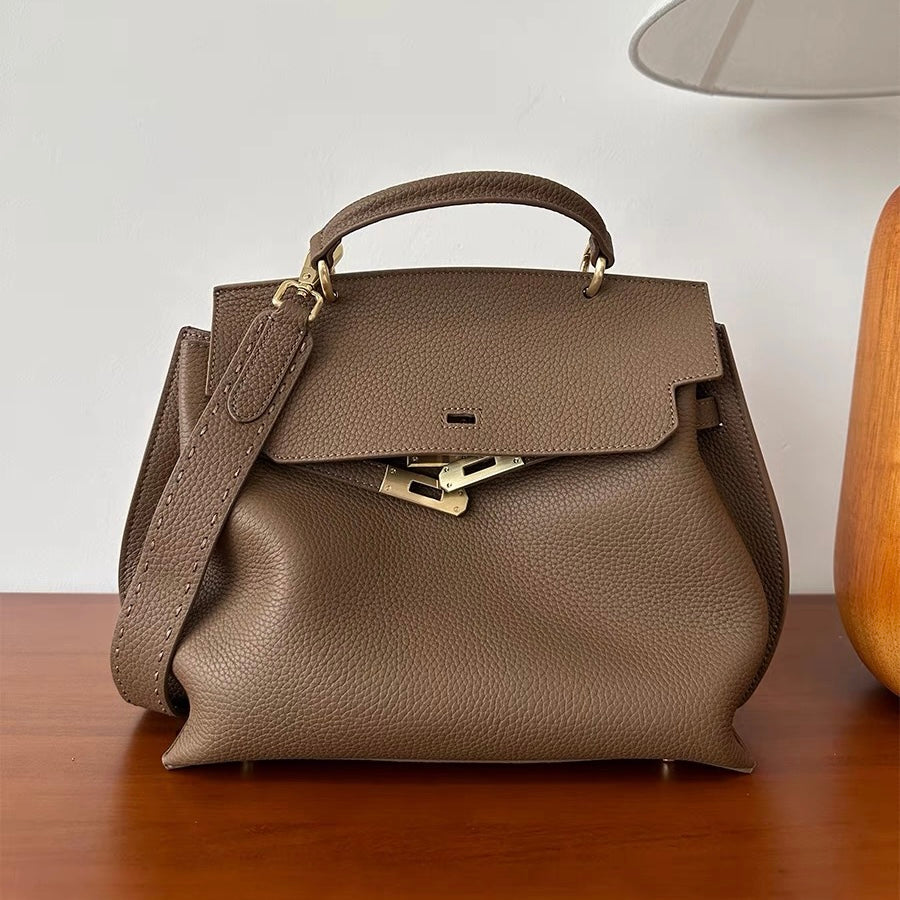 Taupe leather satchel bag shown with shoulder strap