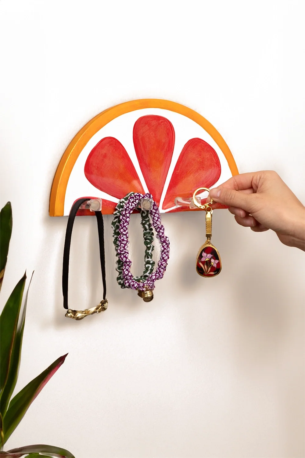 Blood orange slice resin wall key holder, front view