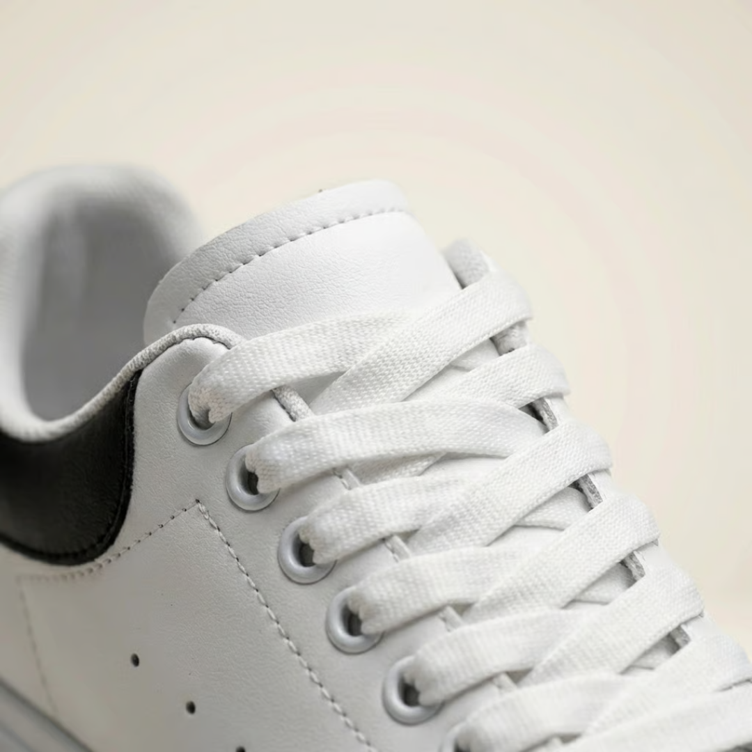 Close-up of lace-up front and padded collar detail