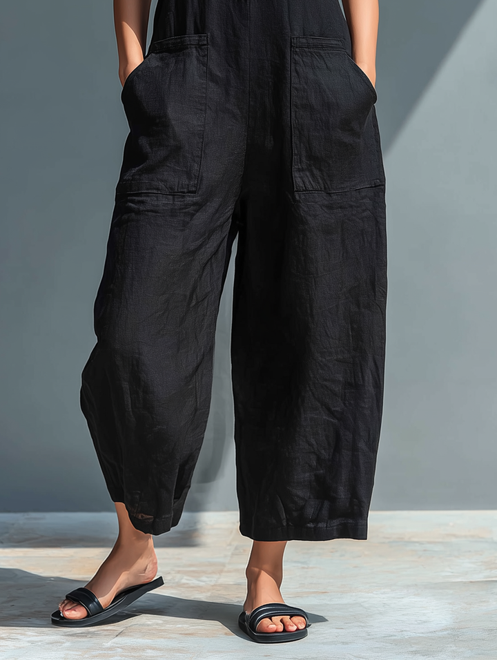 Colette jumpsuit detail — deep patch pockets and wide-leg hem