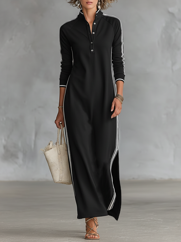Black sweatshirt maxi dress styled with a straw tote, front view