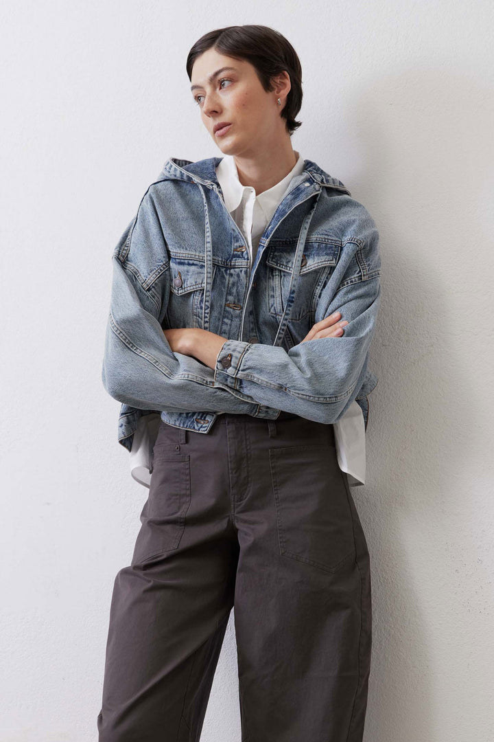 Cropped denim jacket, three-quarter view showing oversized dolman sleeves