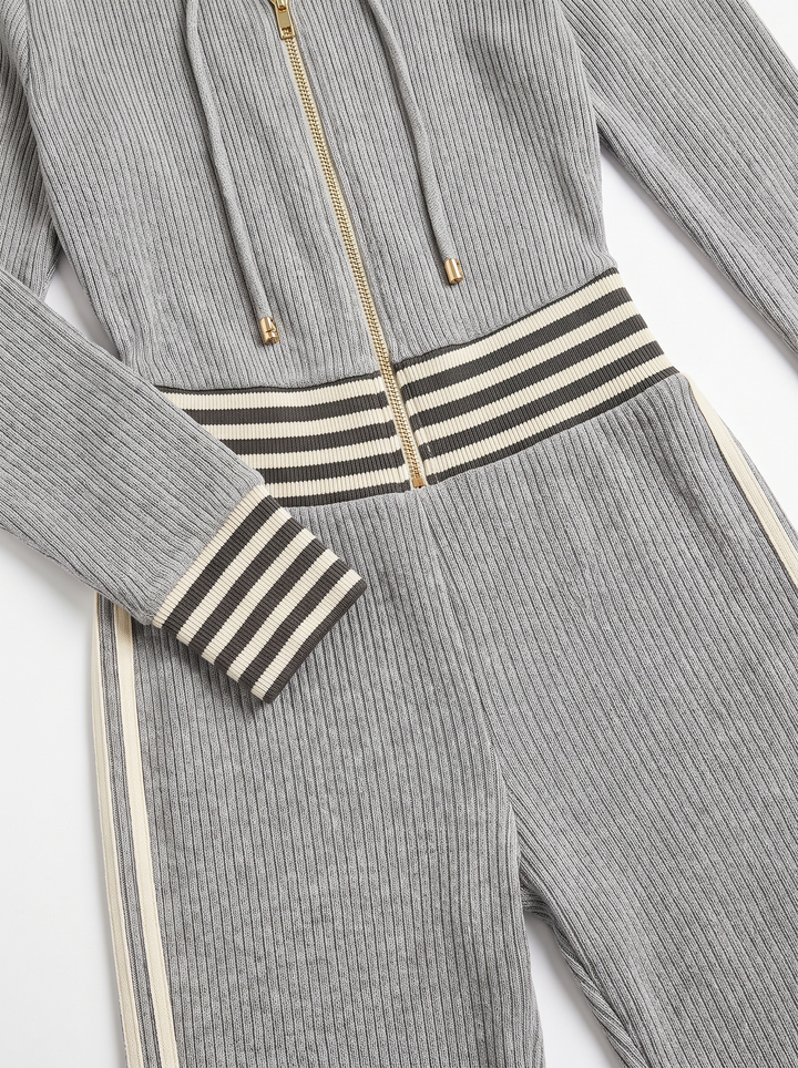 Imogen jumpsuit detail: gold-tone zip, striped waistband and cuff