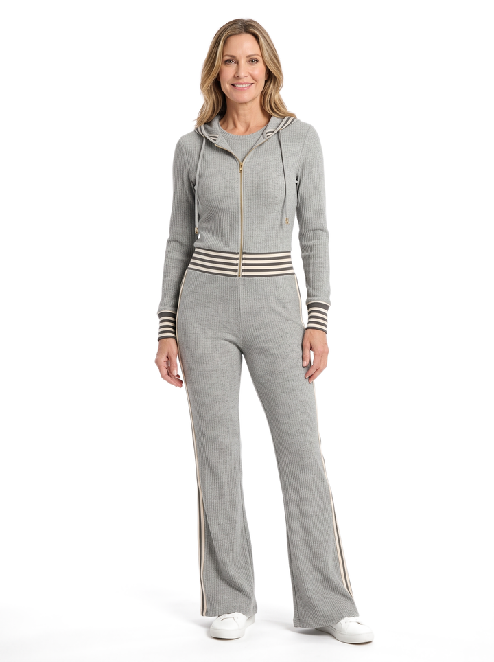 Woman wearing the Imogen hooded zip jumpsuit in heather grey