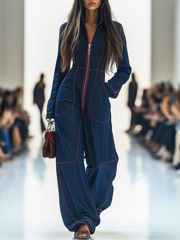 Dark blue denim jumpsuit with zip front and red contrast stitching, front