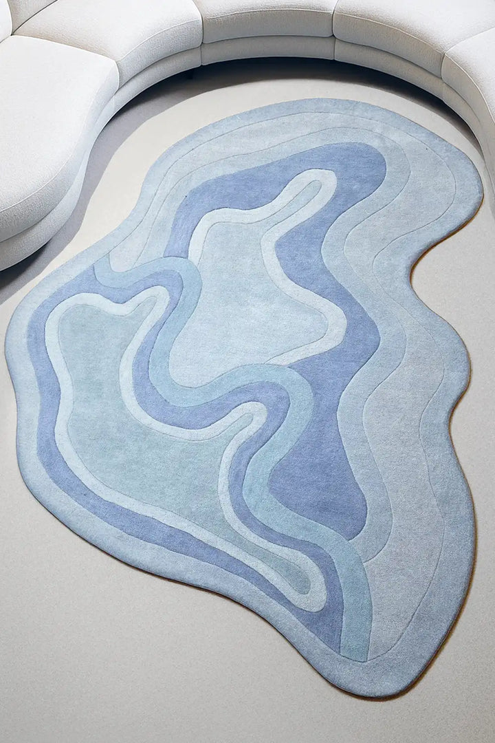 Blue irregular-shaped wool rug in a modern living room