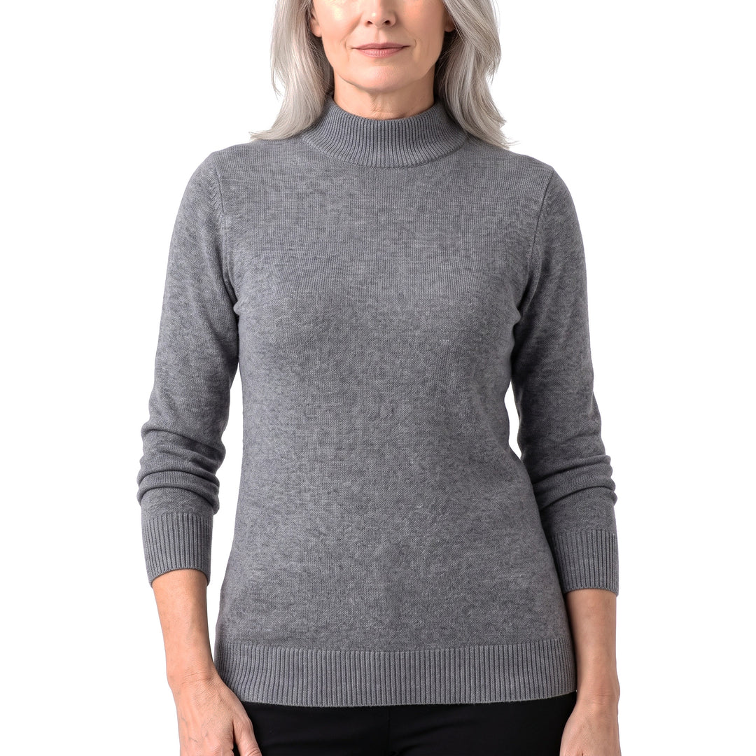 Woman wearing the Sigrid ribbed high-neck sweater in gray
