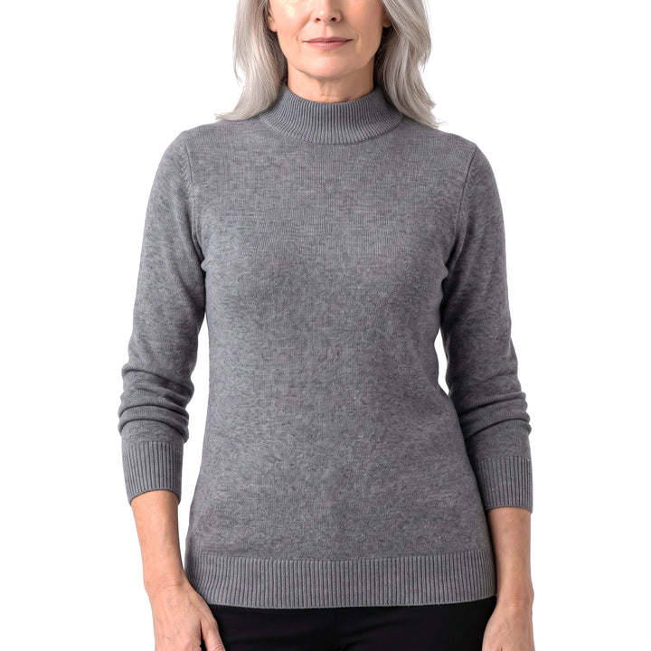 Woman wearing the Sigrid ribbed high-neck sweater in gray