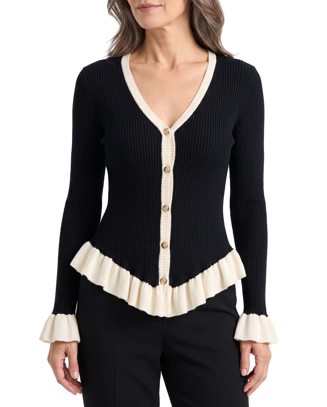 Woman wearing the Joyce contrast-knit V-neck cardigan in black with ivory ruffle trim