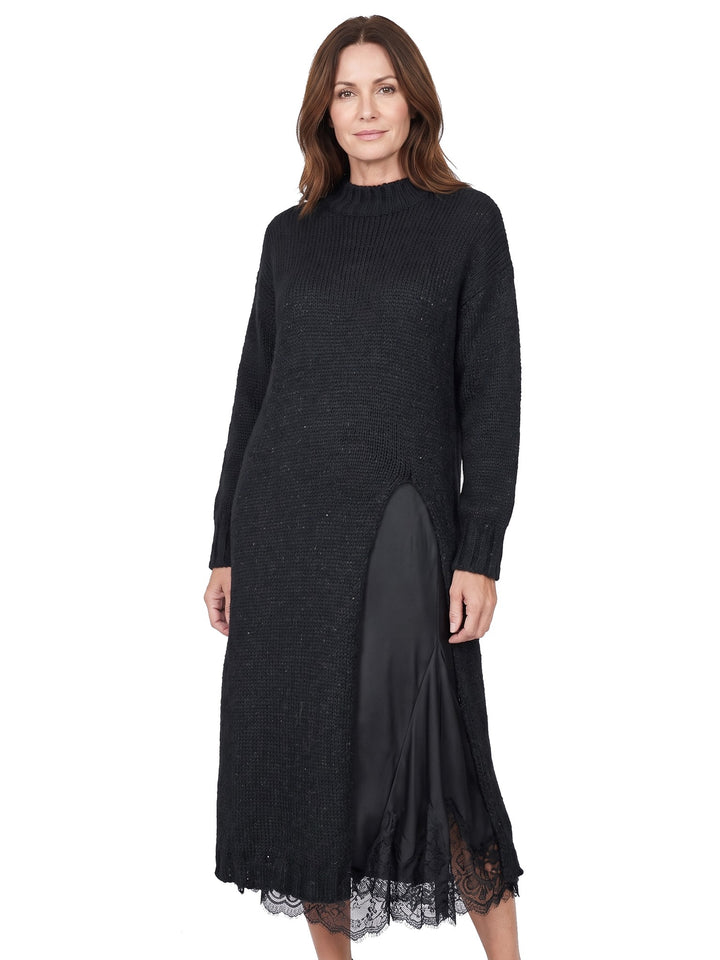 Woman wearing the Iris-Rosemary black knit pullover and lace-trim slip dress set
