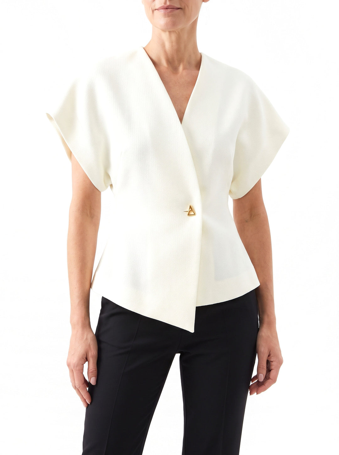 Woman wearing the Stella-Aurelia cream cropped notch-lapel blazer