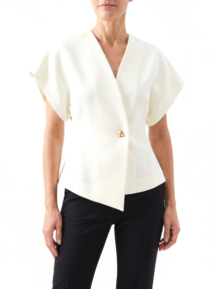 Woman wearing the Stella-Aurelia cream cropped notch-lapel blazer