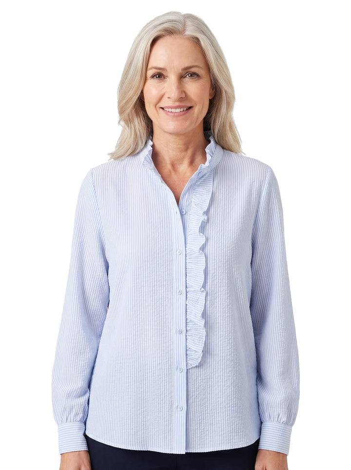 Woman wearing the Ivy-Vera light blue wide-sleeve ruffle-front blouse