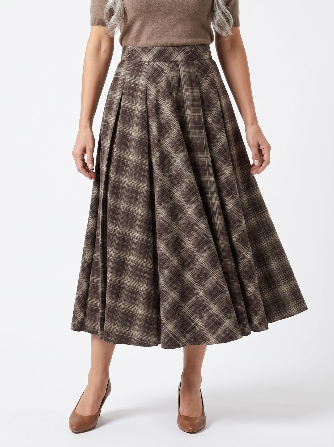 Nadine-Lorraine pleated checked midi skirt worn by a model, studio white background