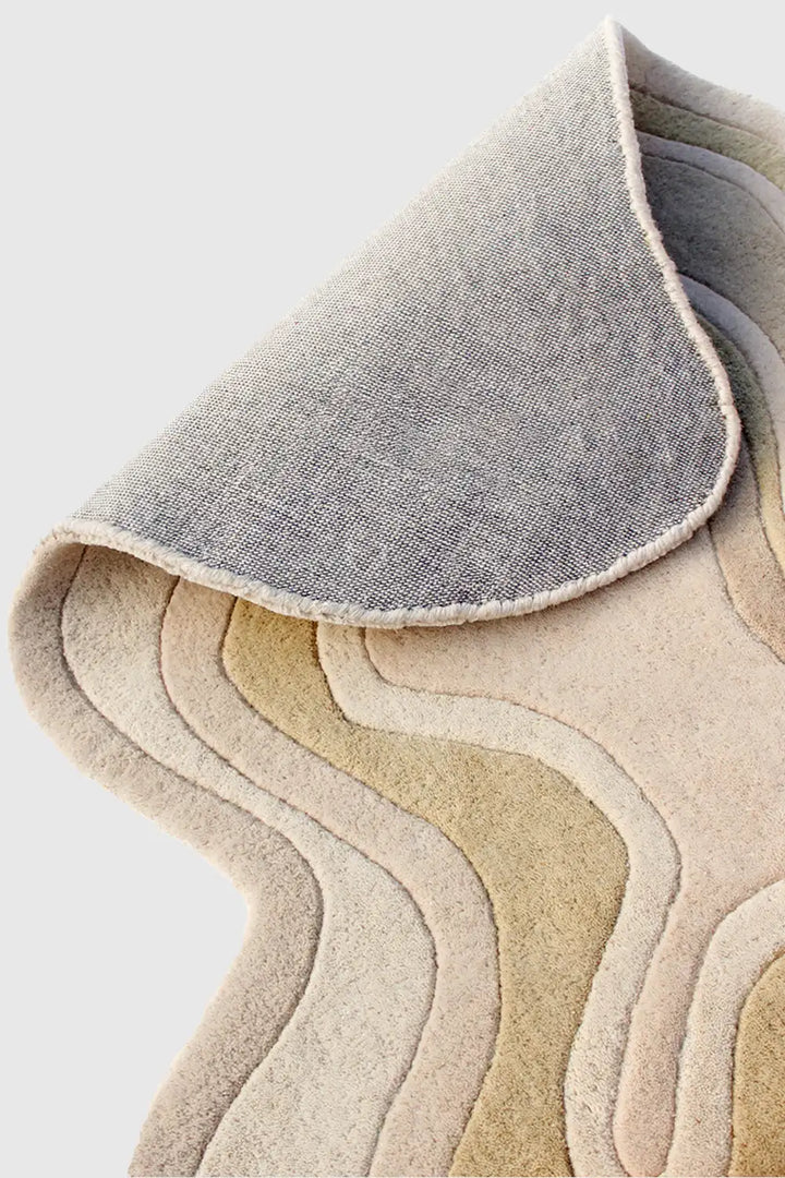 Hand-tufted wool rug finishing detail and sculpted pile